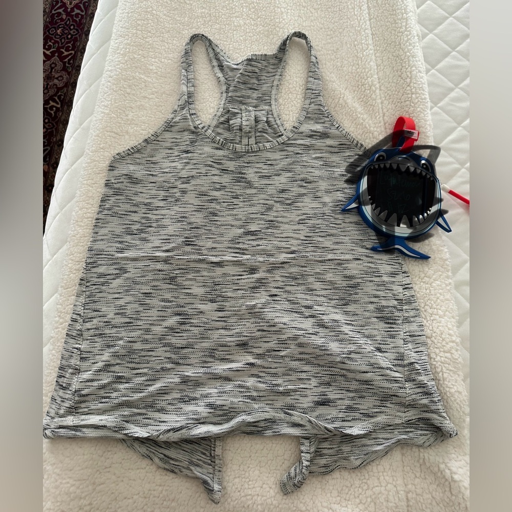 Lululemon tank. White and black. Tie in back. Like new. Size 6.